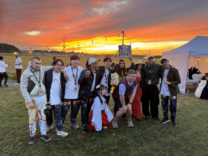 Partner and community gathering at sunset in Japan