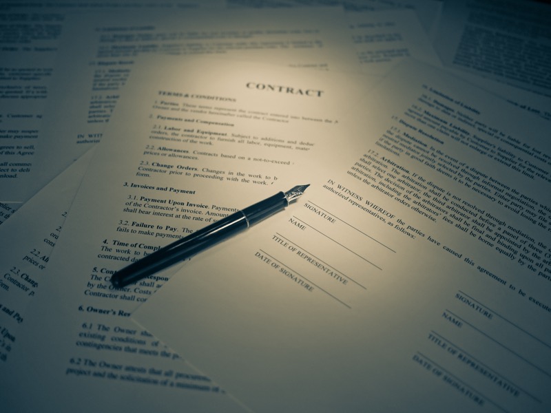Contract documents and pen for business setup planning