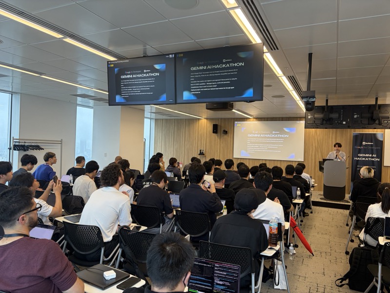 Audience watching a Google Gemini AI Hackathon presentation in Tokyo