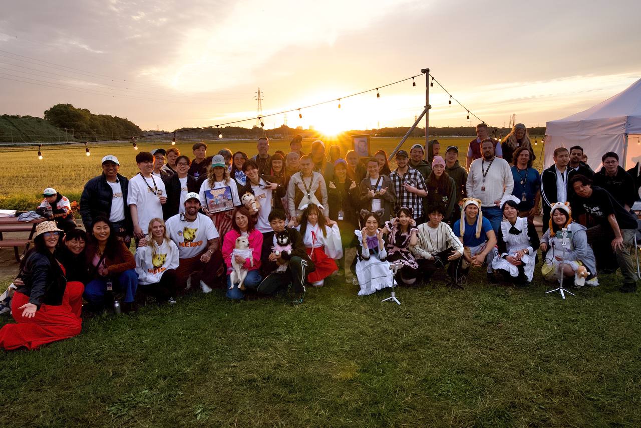 Kakehashi community gathering with Japanese and global members at sunset